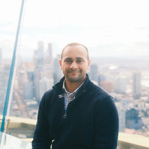 Shreyas Sane, photographed against a city skyline.